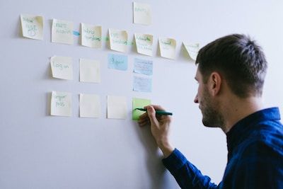 Man writing on sticky notes