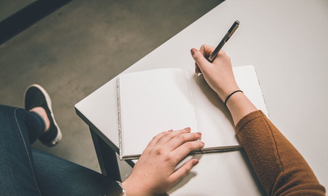 Hand writing on a notepad