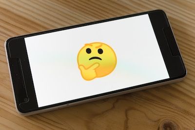 Thinking emoji on mobile phone screen
