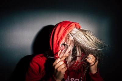 Woman in red hoody yelling