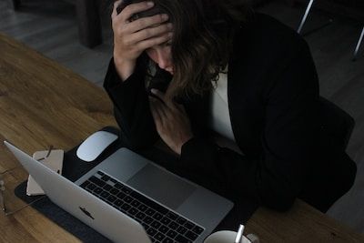 Woman upset at laptop
