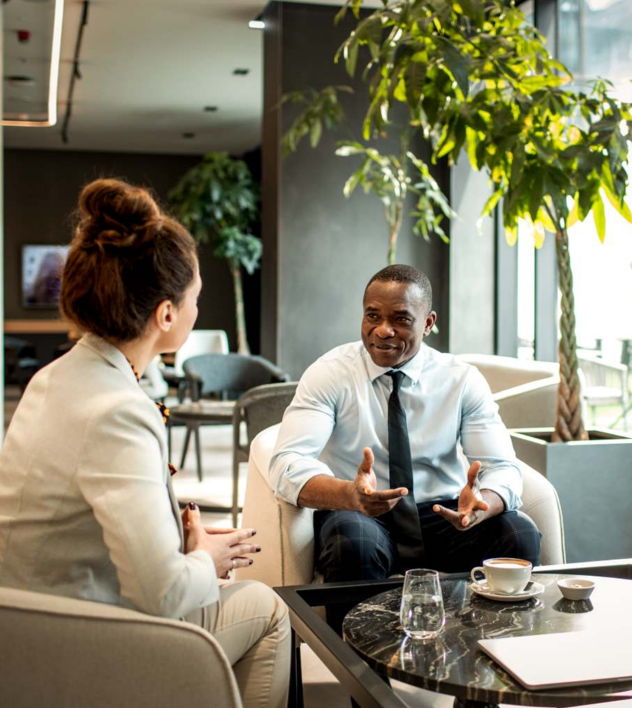 Male and female meeting in an open office