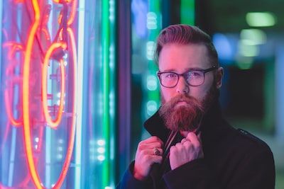 MAn in front of neon