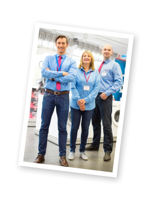 3 retail sales team members in blue shirts with red tie - all smiling