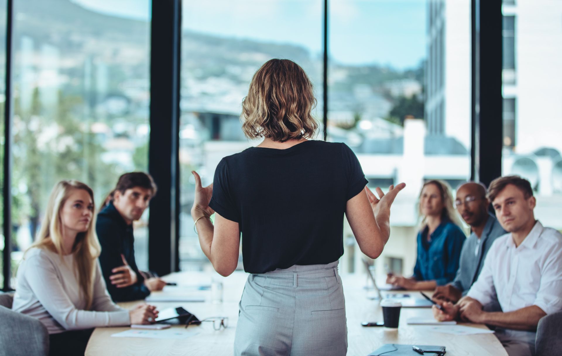 woman giving presentation at work 