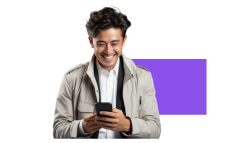 A man smiling while using a cell phone during Compliance & Ethics training, being engaged due to captivating experience.