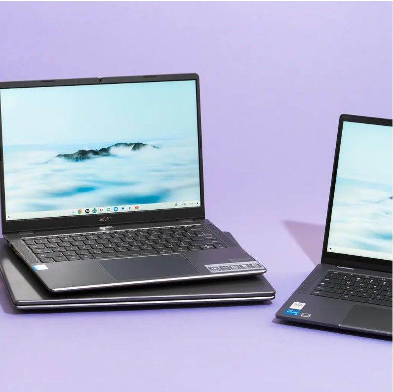 Two modern laptops displayed on a table, showcasing portable computer options for everyday use, school, or work.