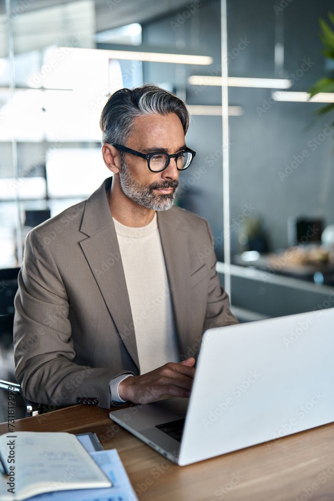 Clinician's Code man holding a laptop