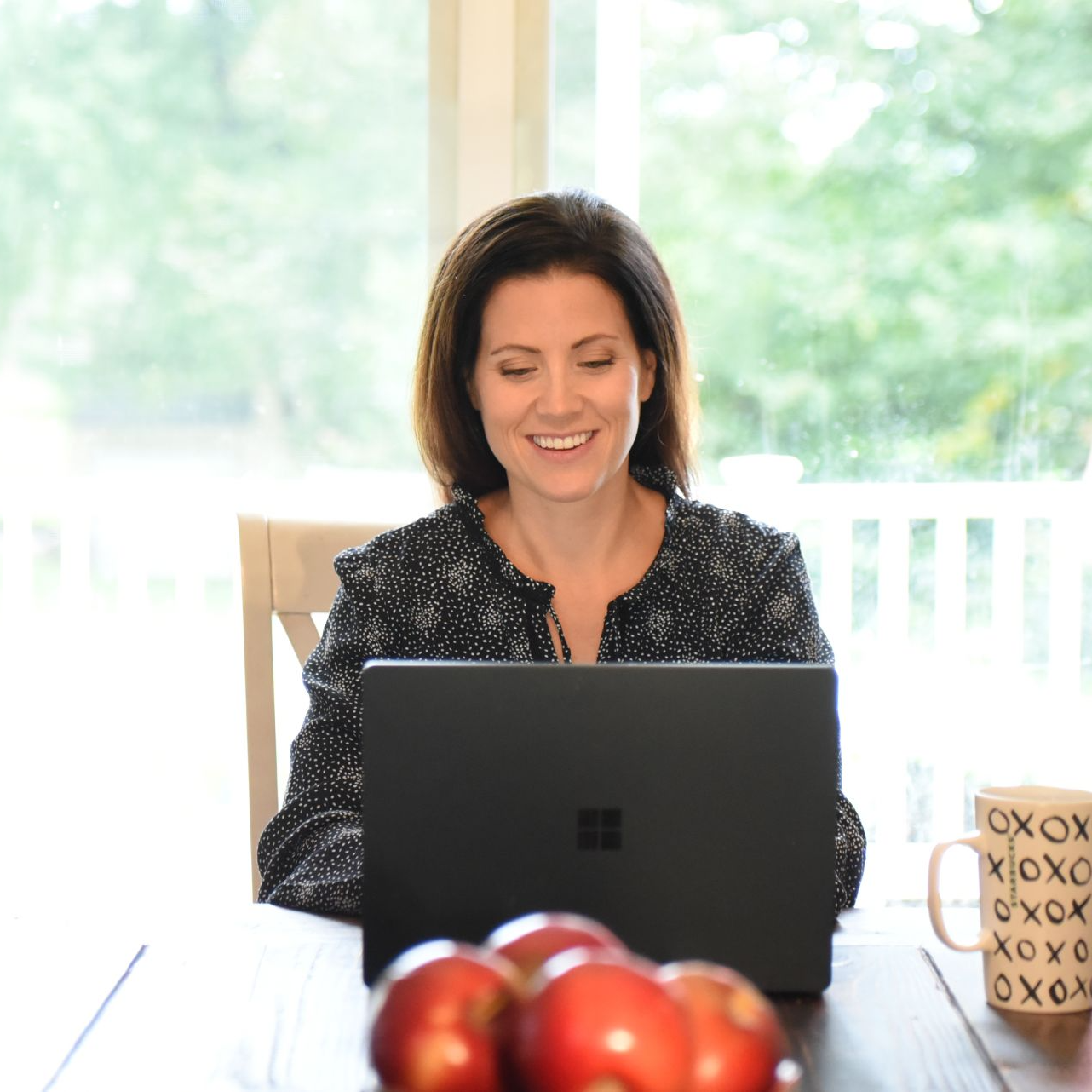 Clinician's Code course instructor and mentor Dr Julie Walsh sits at his desk, smiling at the camera. 