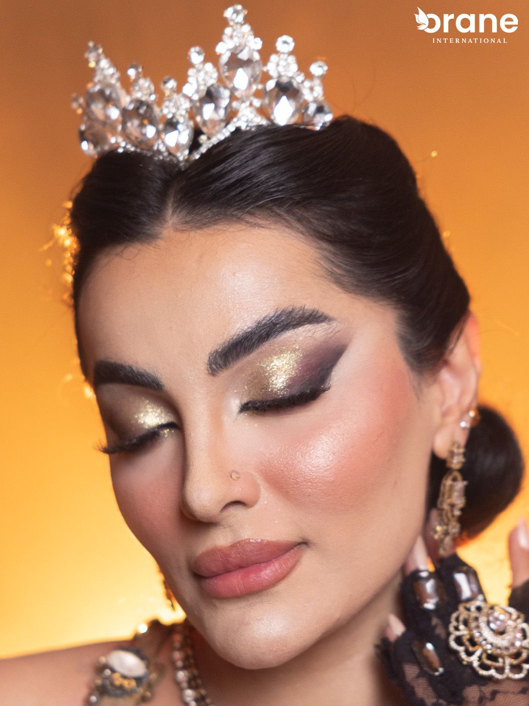 Editorial glam makeup with crown