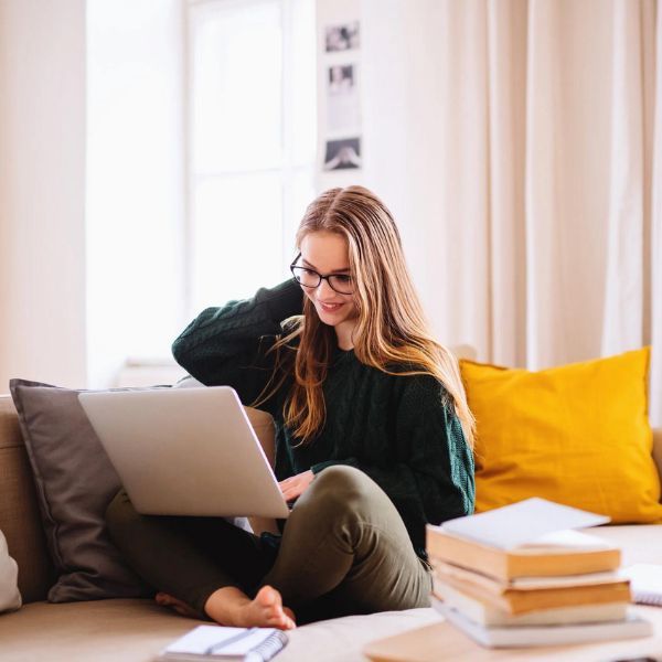 Student completing online pharmacy technician training at home