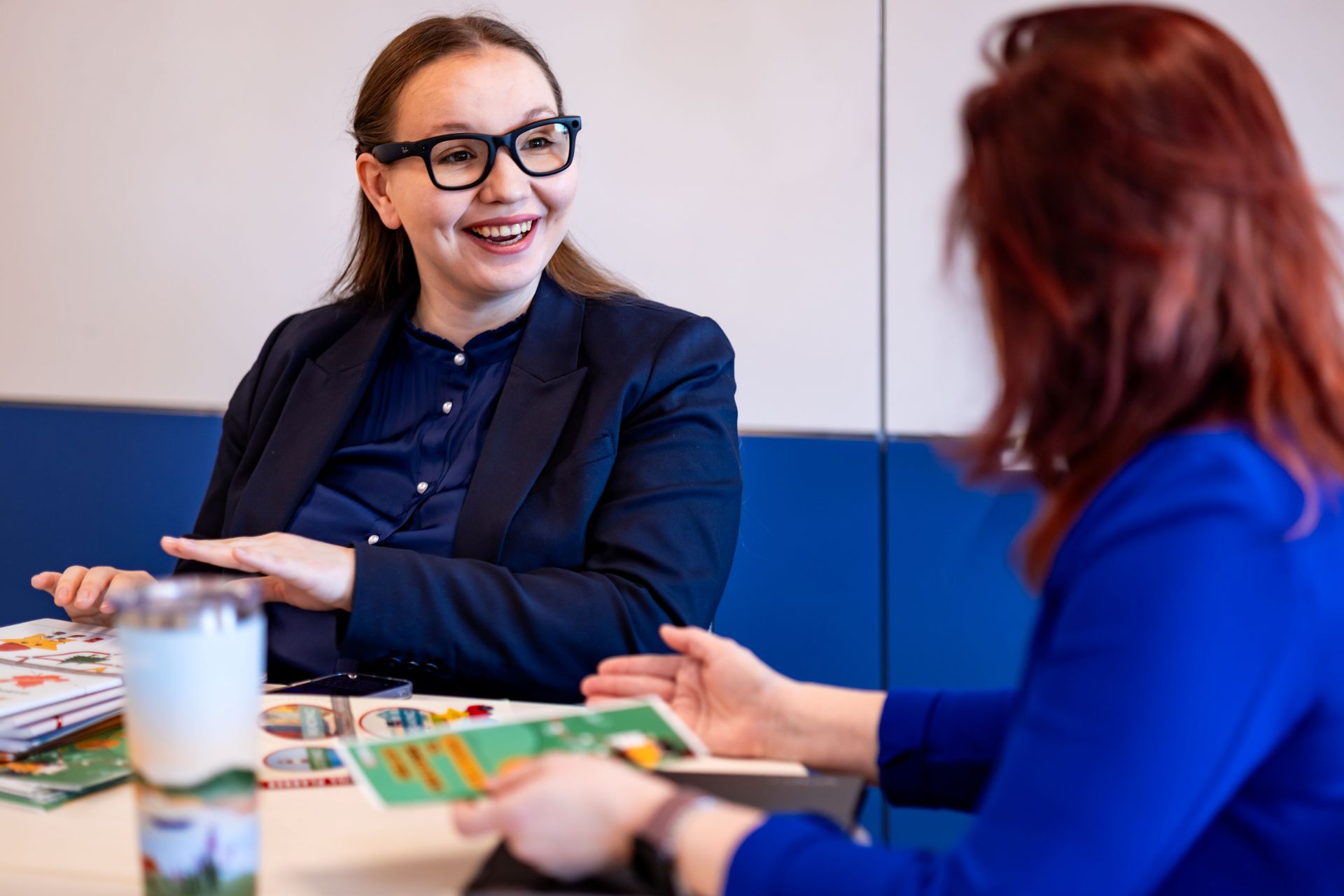Karolina working with a learner at a table