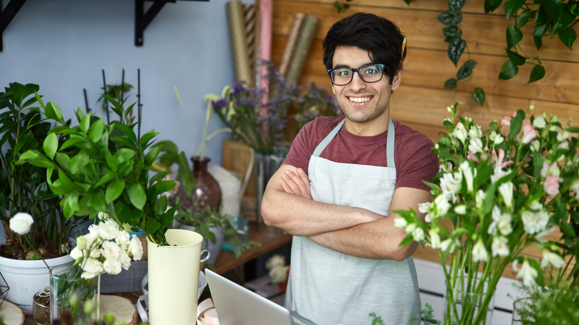 Flower shop entrepreneur at his place of business