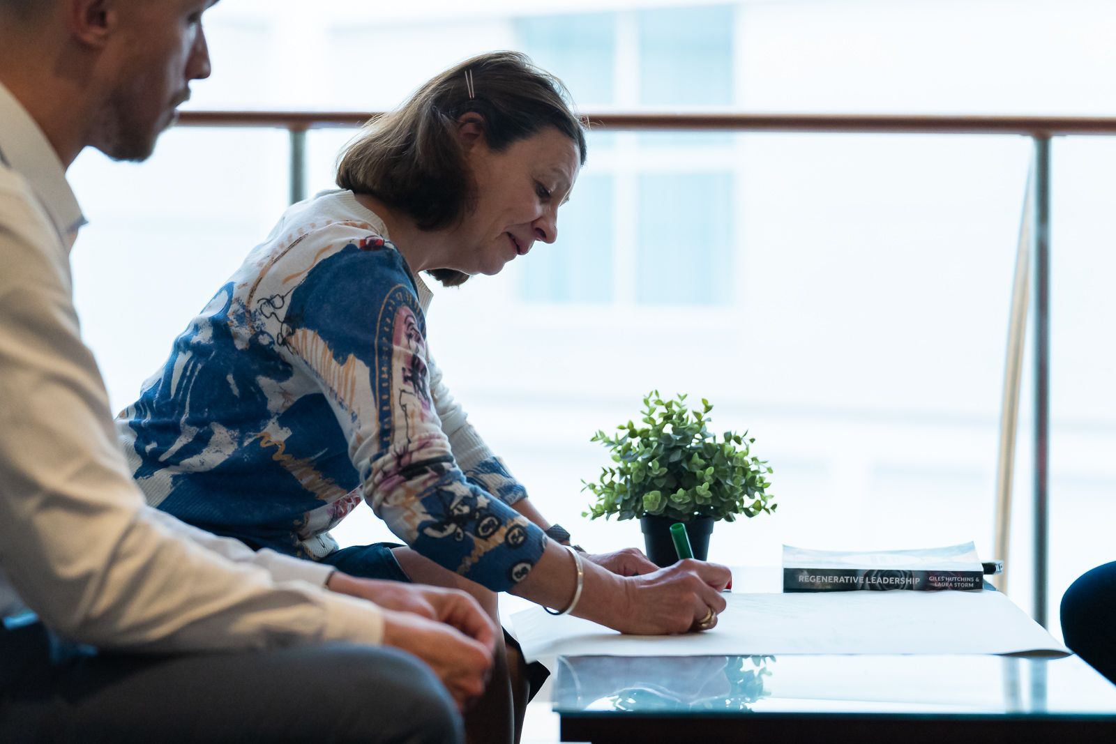 lady writing on a desk