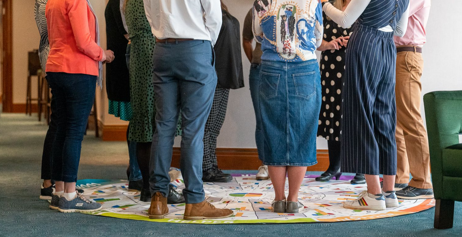 a photo of number of people legs stood on the insights mat