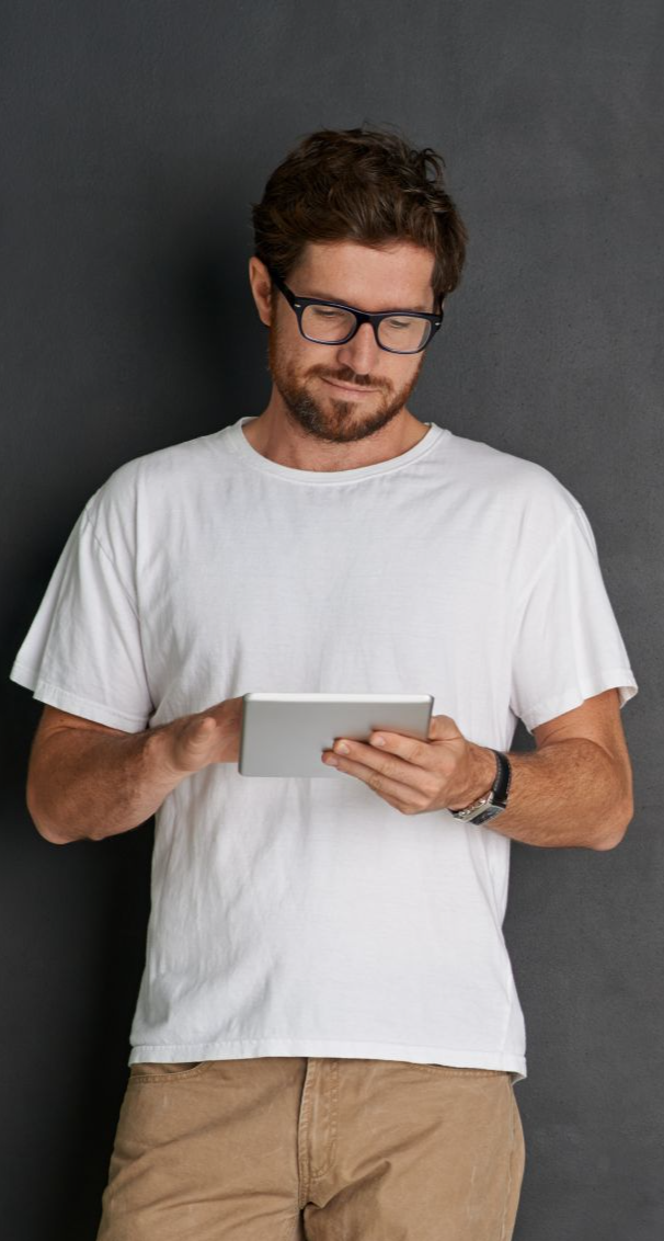 Inspector checking licence requirements on a tablet