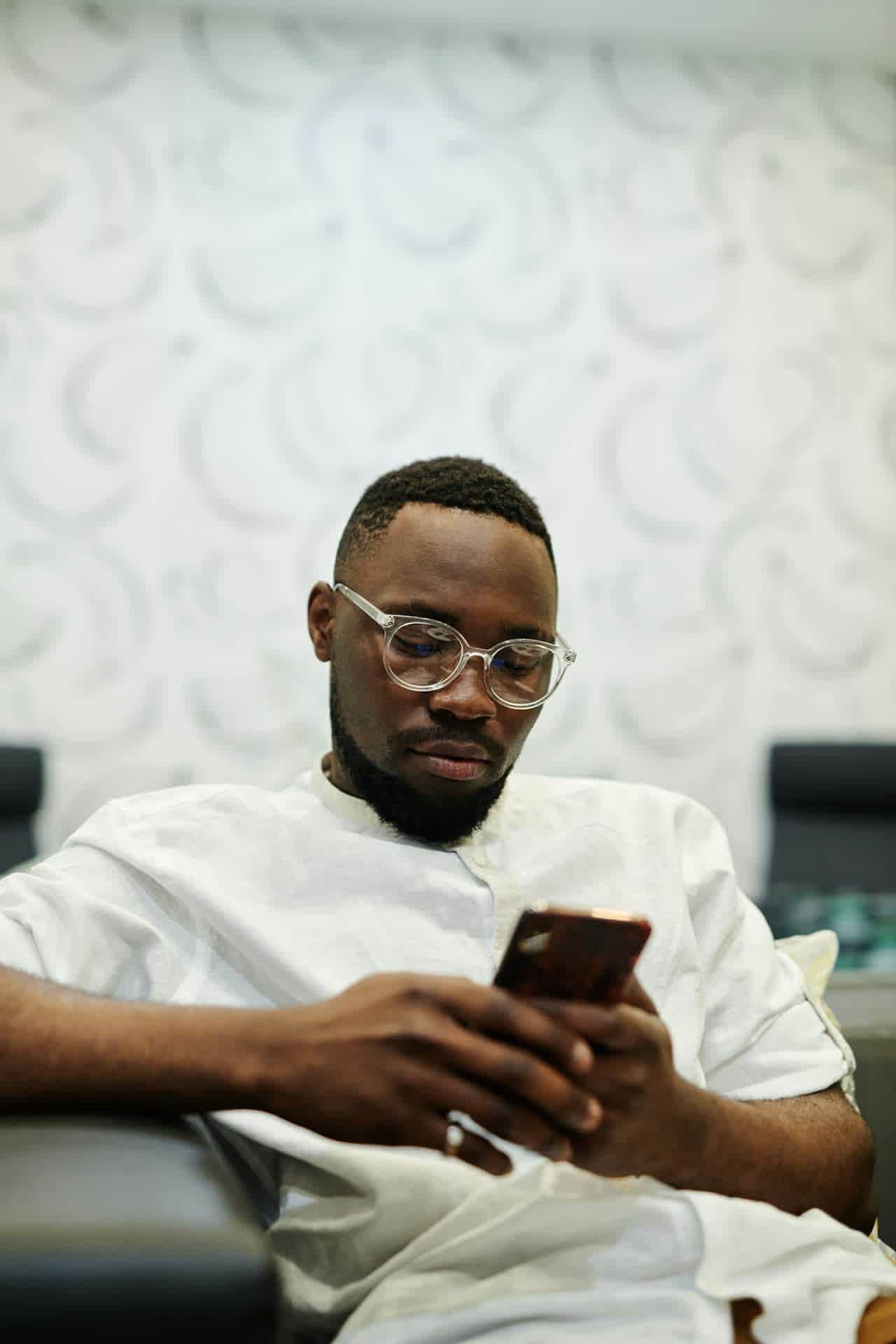 man scrolling on the phone
