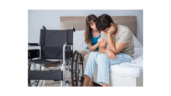 woman supporting man in wheelchair