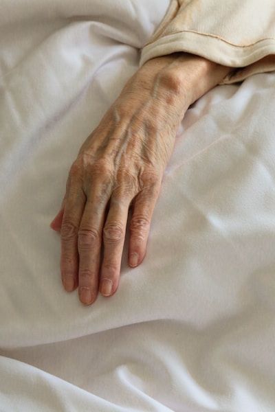 elderly hand with fragile skin