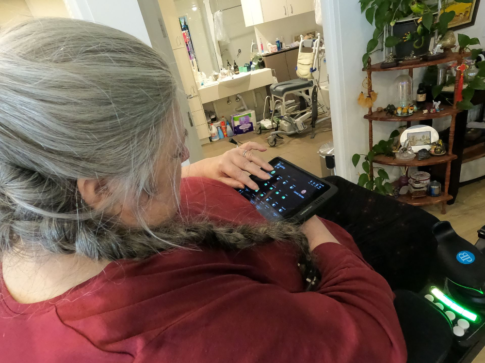 wheelchair user using a home automation app