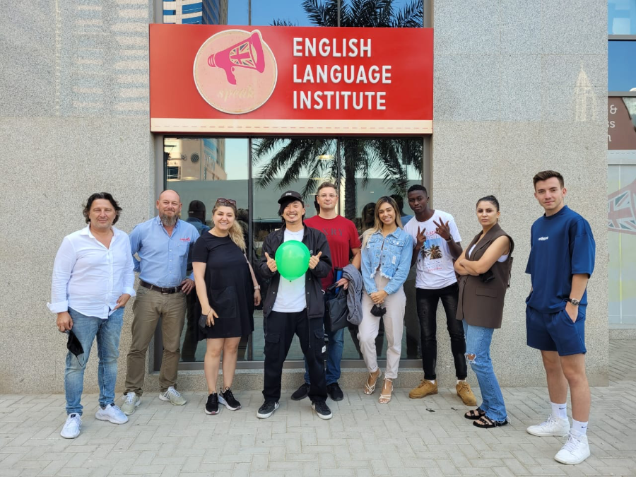 English students standing outside of Speak English Institute in Dubai