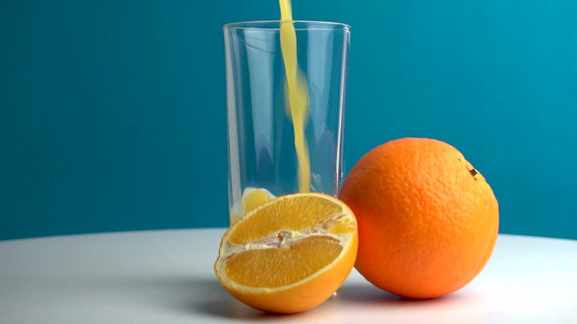 Pouring a glass of orange juice