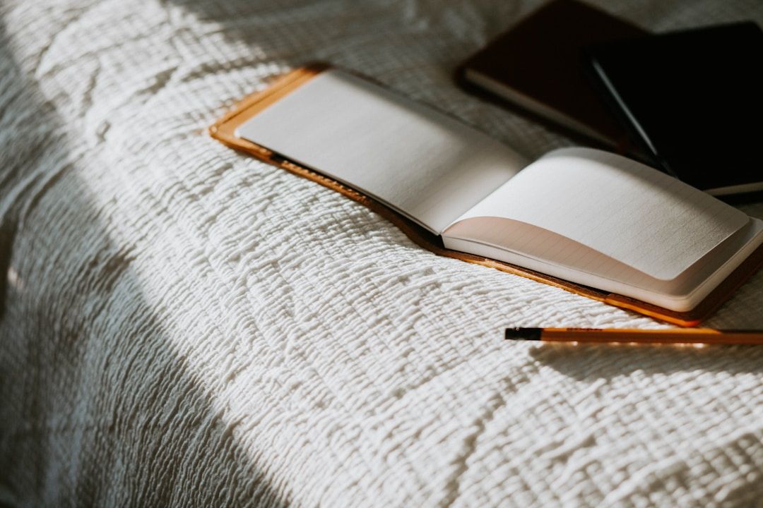 journal sitting on a bed
