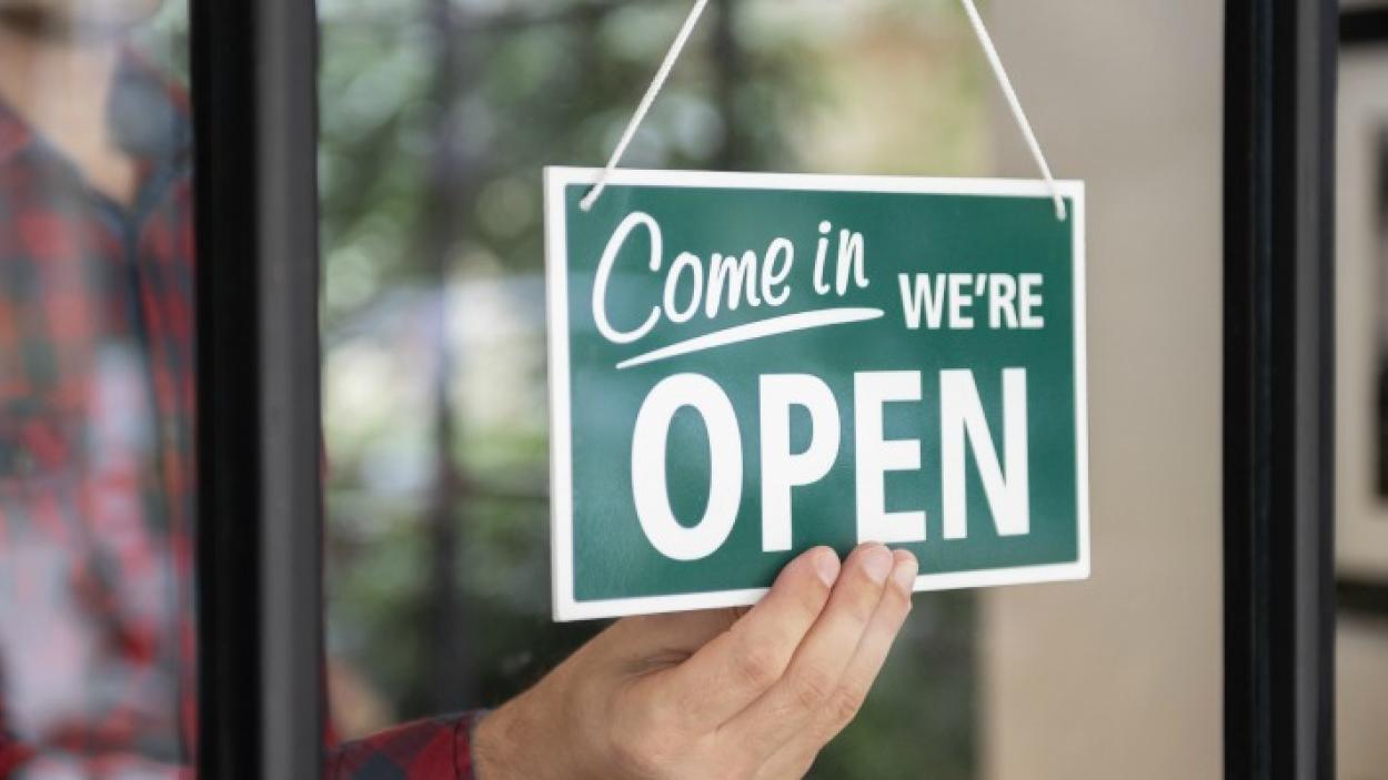sign showing "We are open"