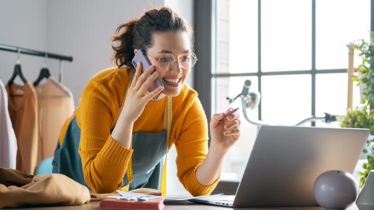 business owner serving customer at coffee shop