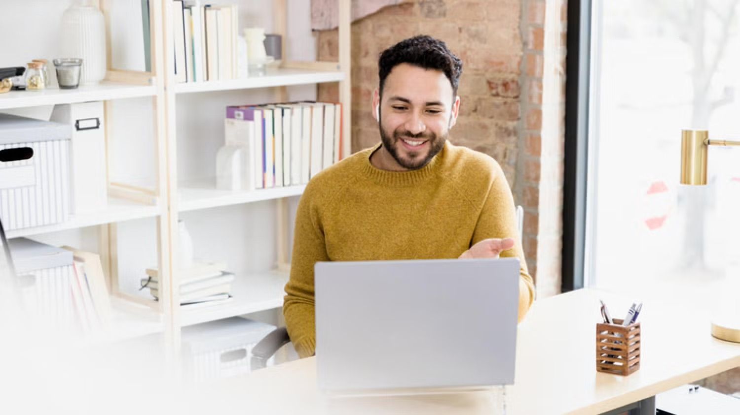 man taking business call on laptop