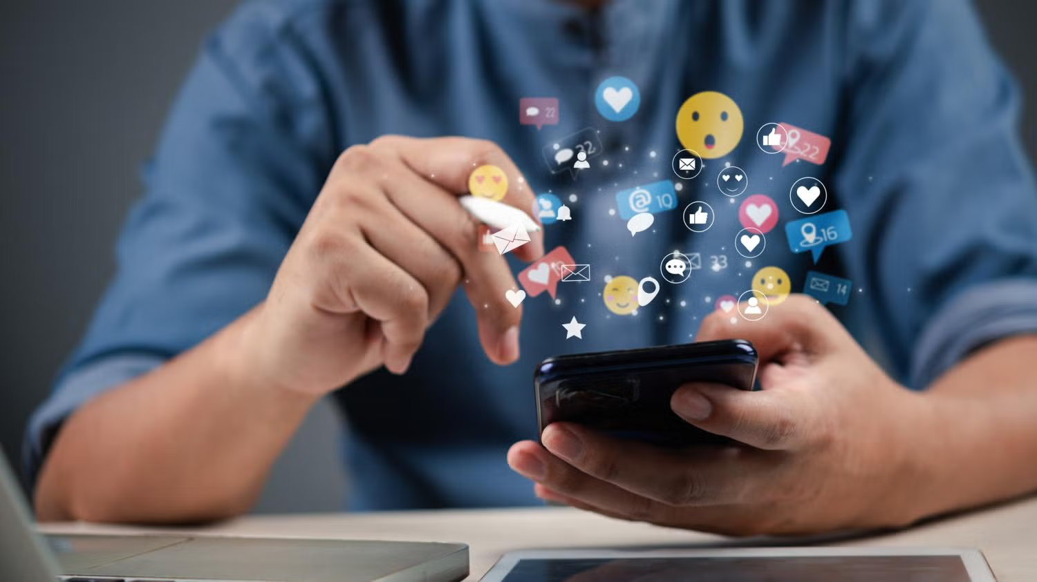 social media icons floating above phone