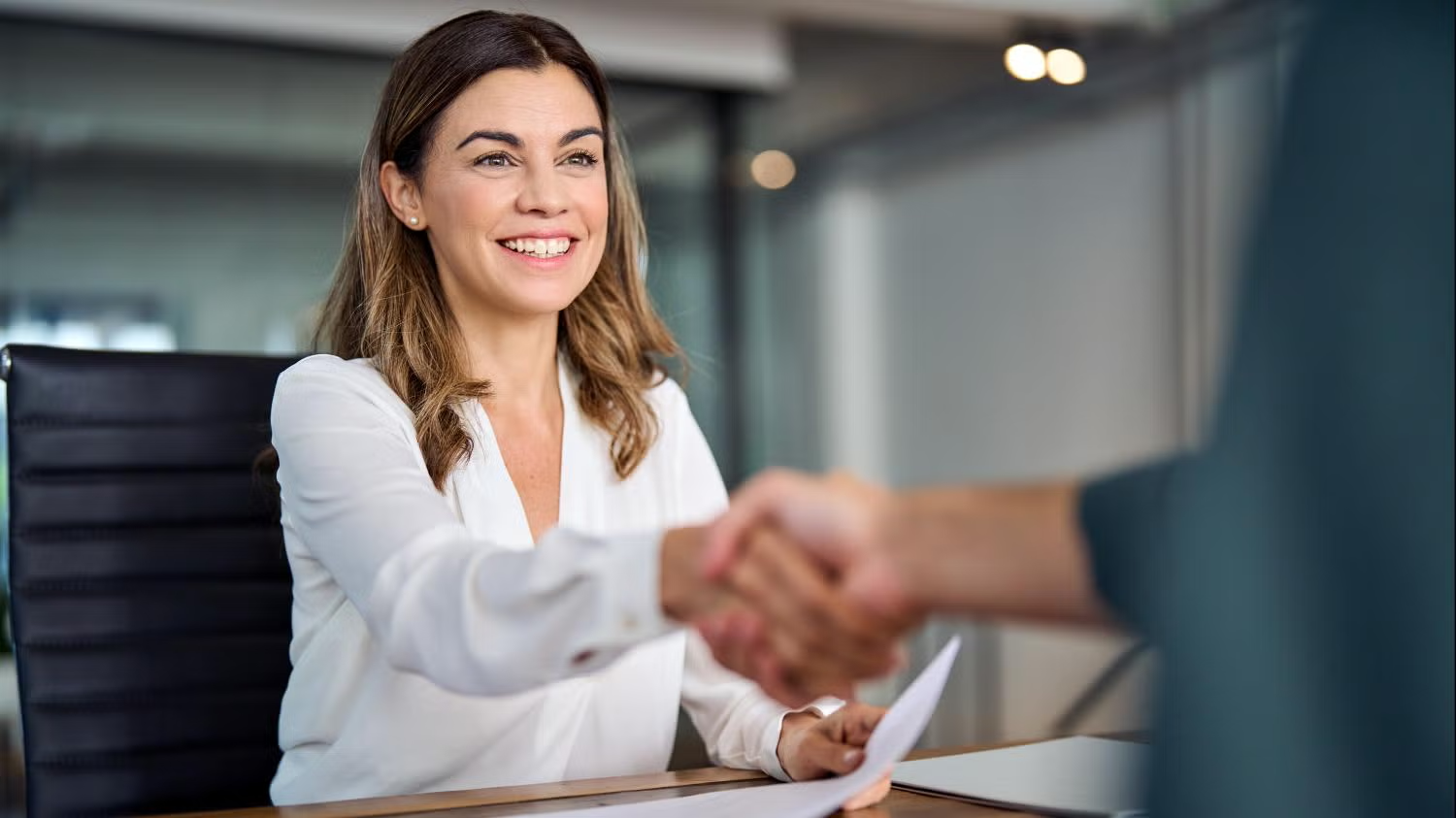 businesswoman writing in notebook