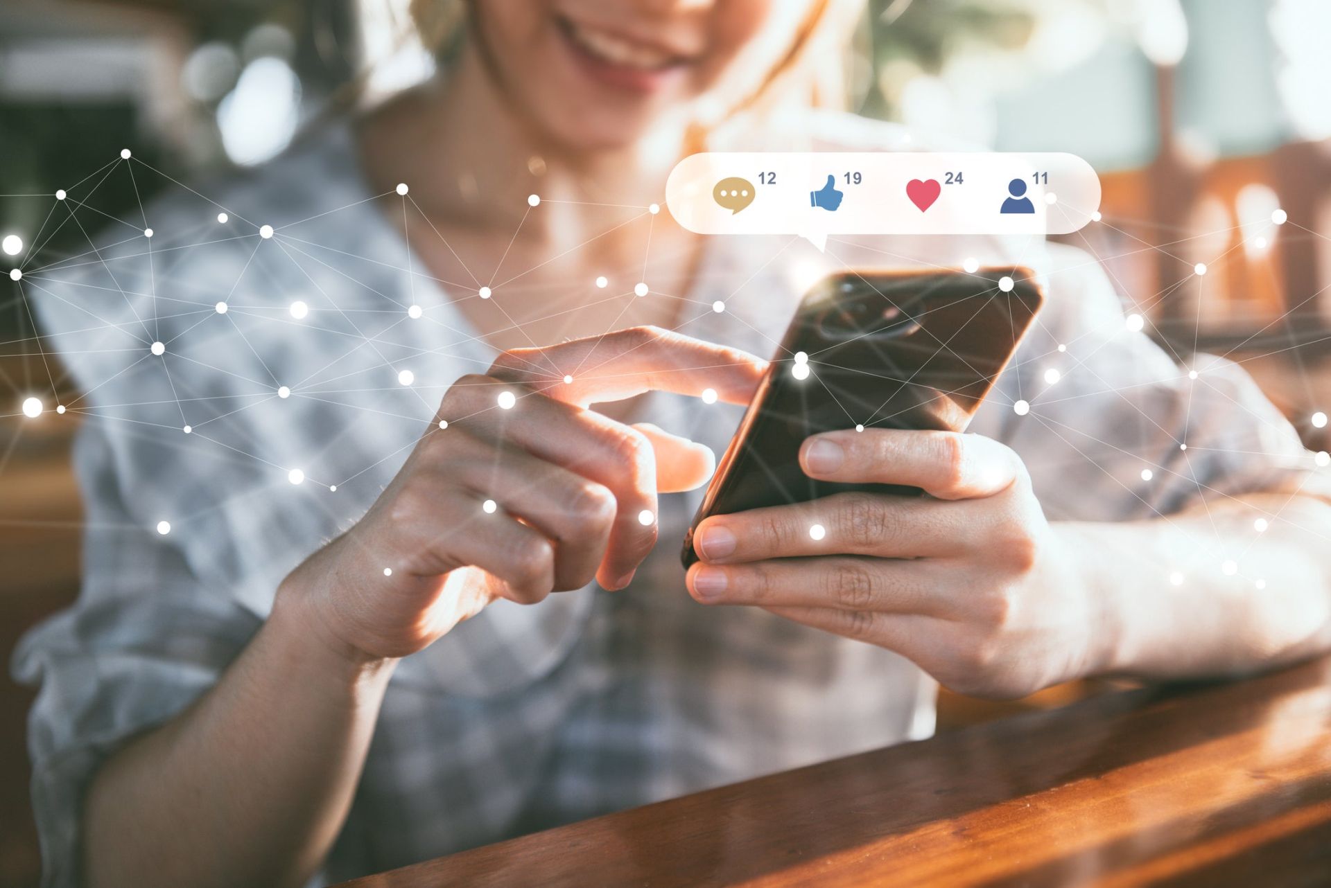 person using laptop with metrics graphics hovering above