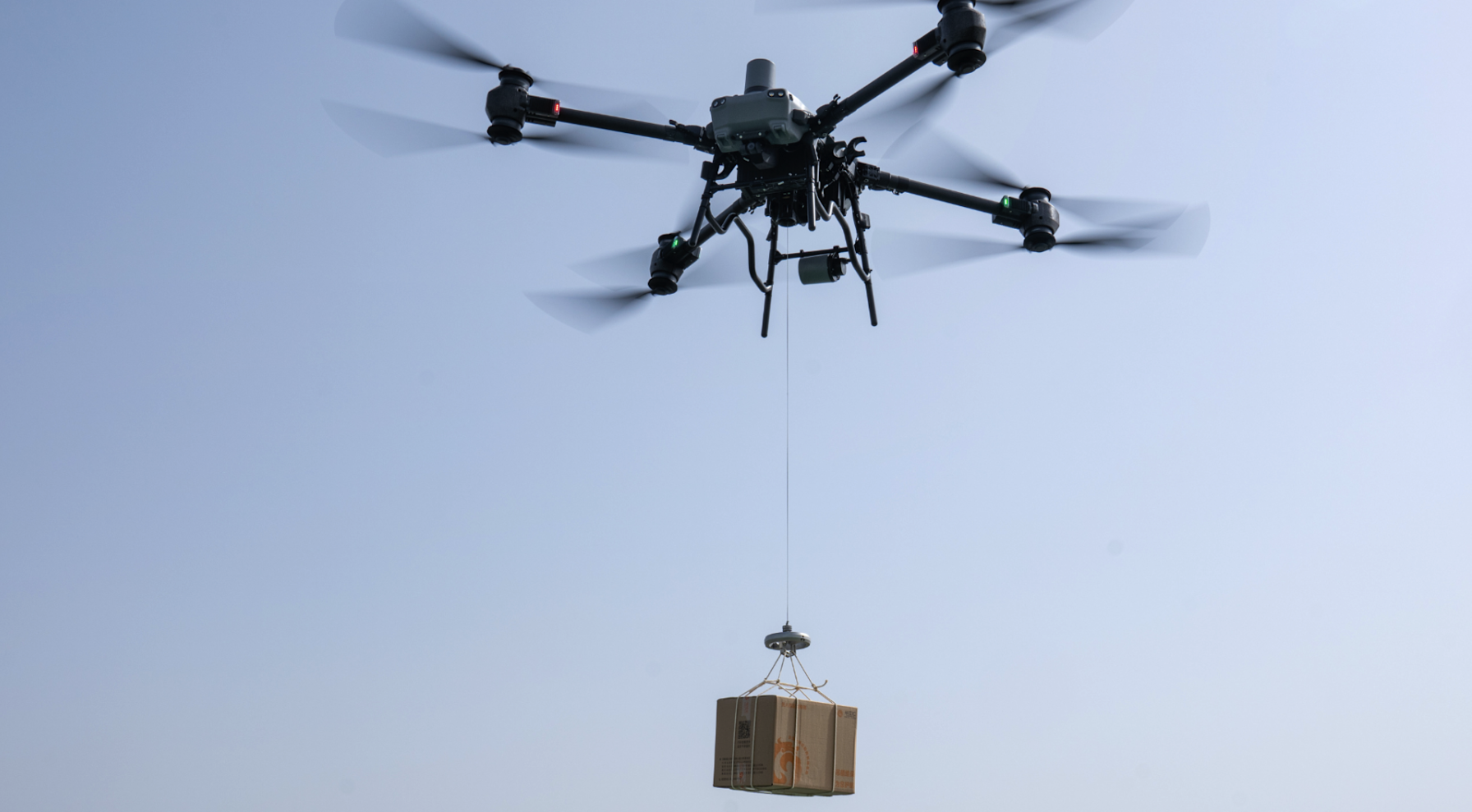 Multirotor aircraft carrying operational equipment