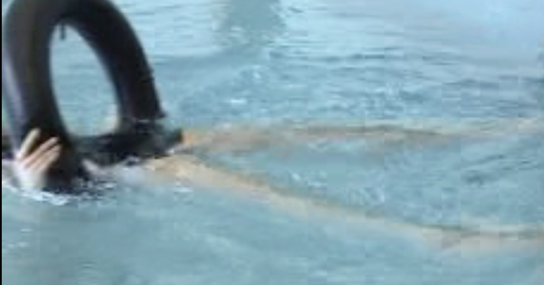 A client floats with a ring supporting the neck.