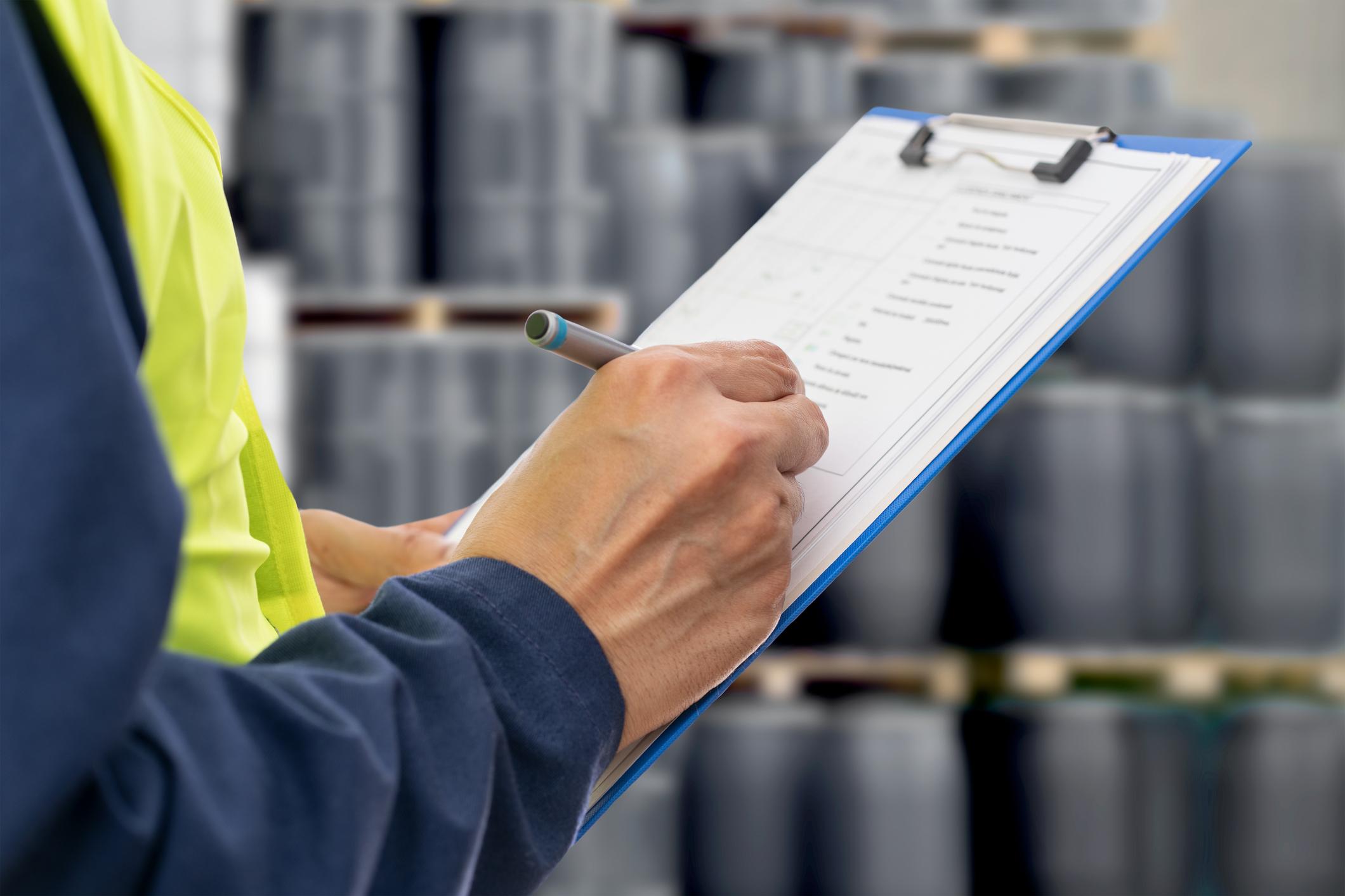 radiation safety officer holding a clipboard