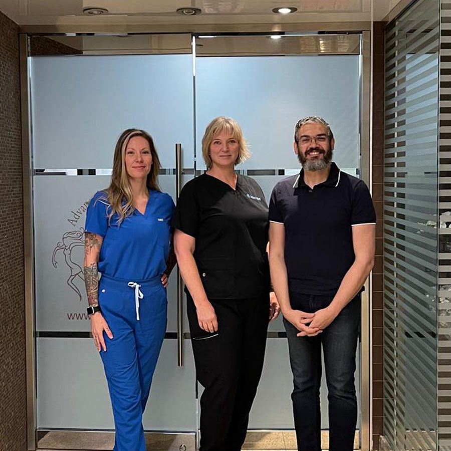 Instructor Vicki Mulyk posing with students after completing hands-on dermal fillers and neurotoxins training