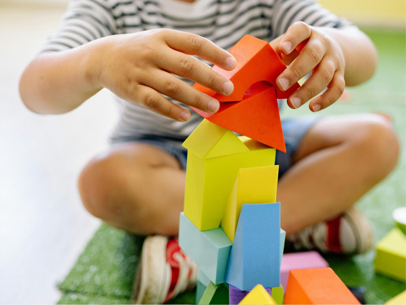 child building tower with blocks