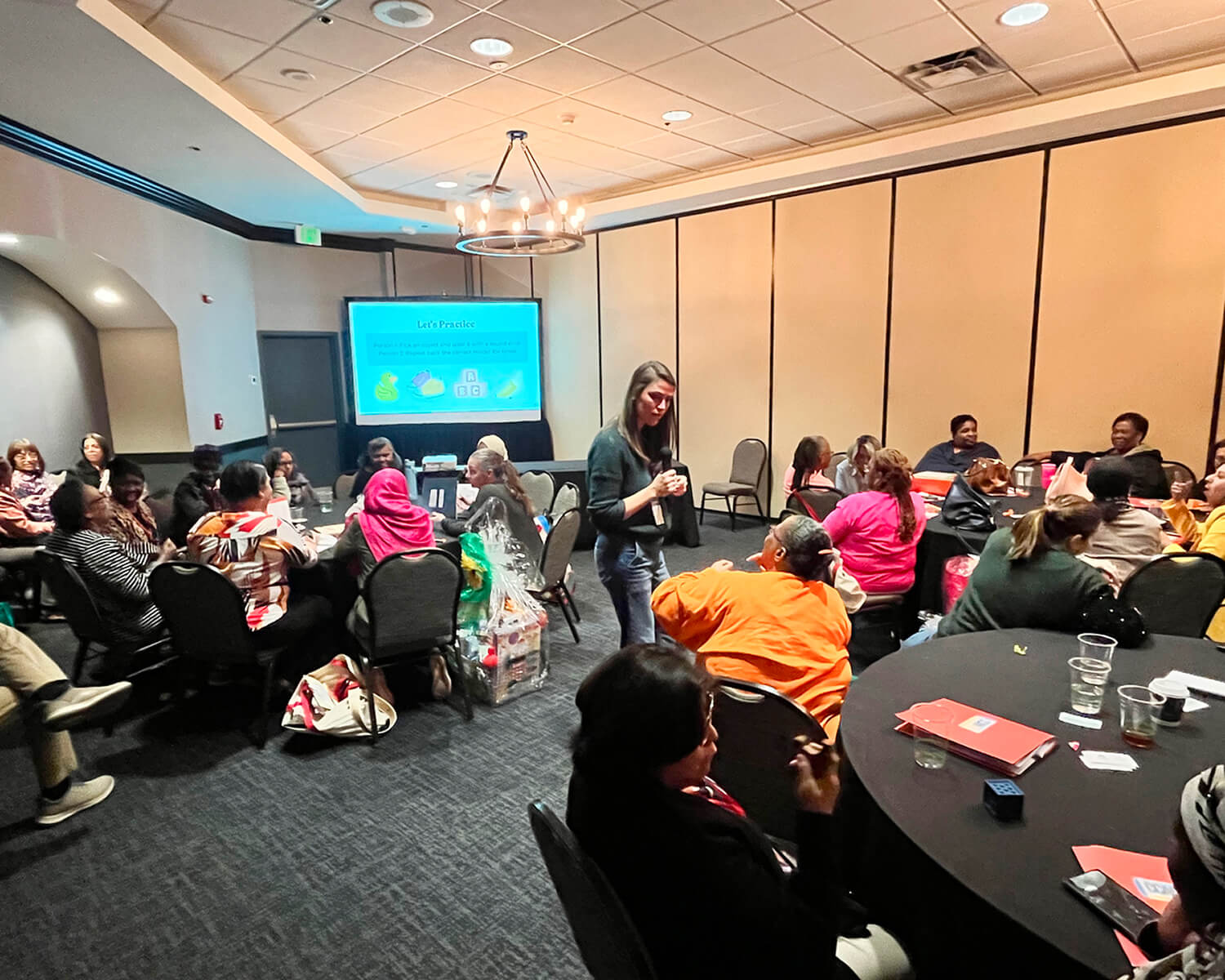 Kelly Goldberg providing an in person training to a group of child care providers