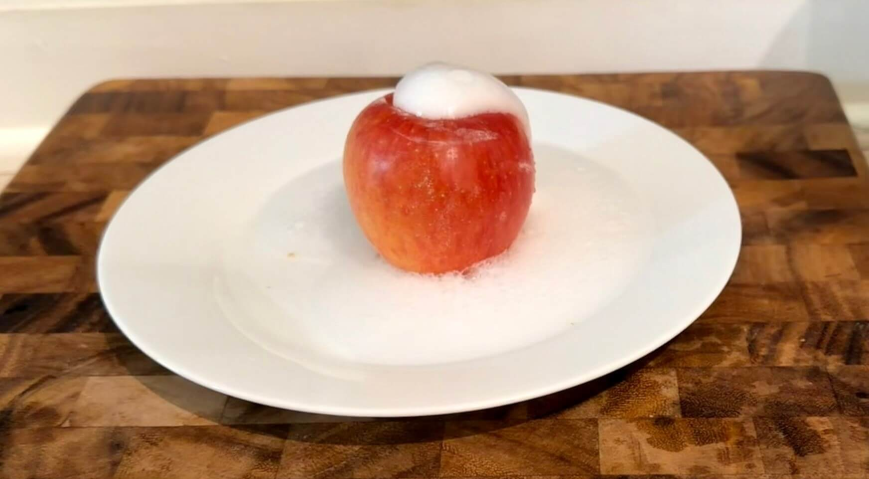 white fizz coming out of apple like a volcano