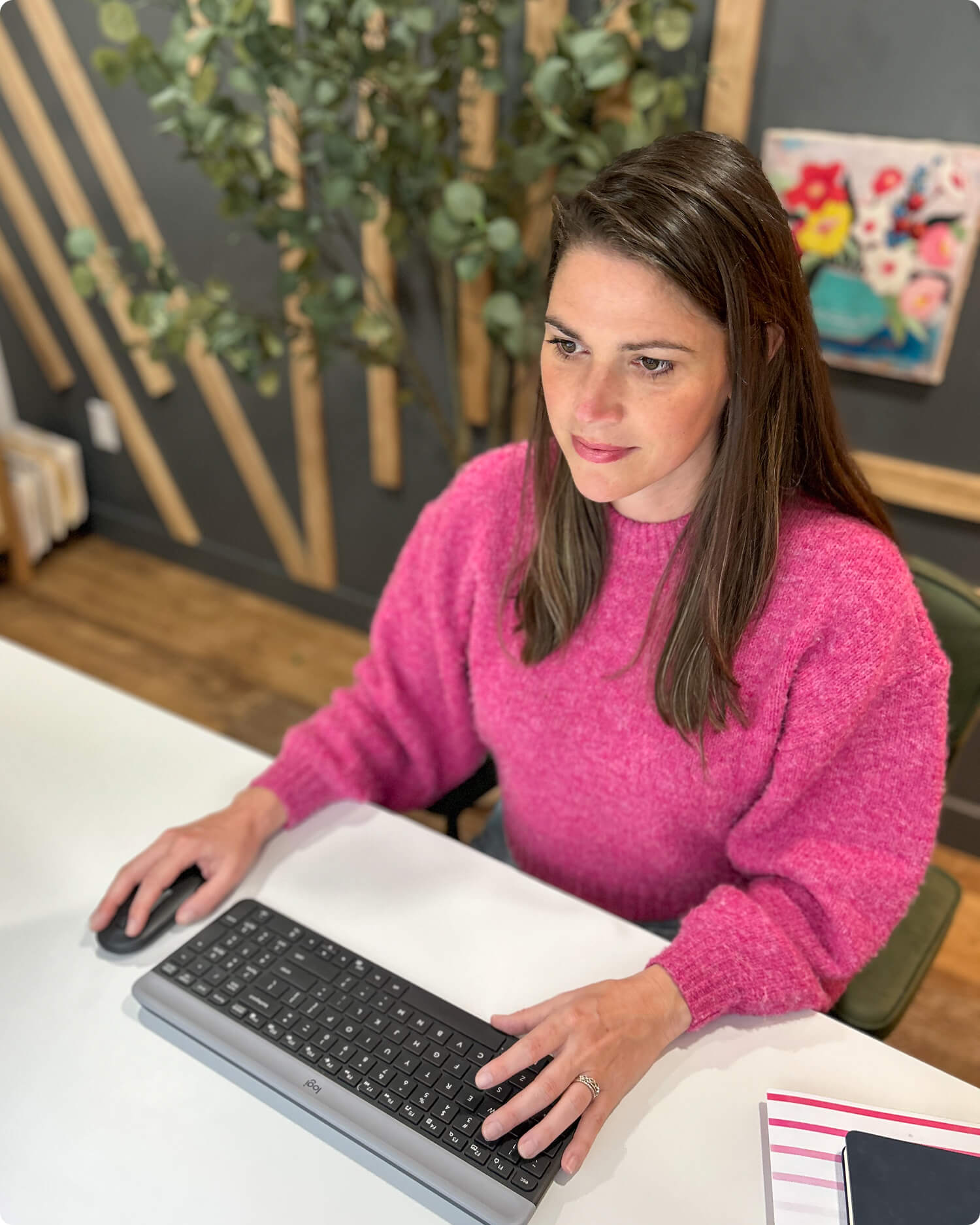 Speech-language pathologist creating early childhood education training at a computer