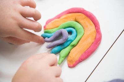child playing play dough