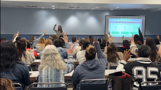 Kelly Goldberg, speech therapist, giving a large group in-person training