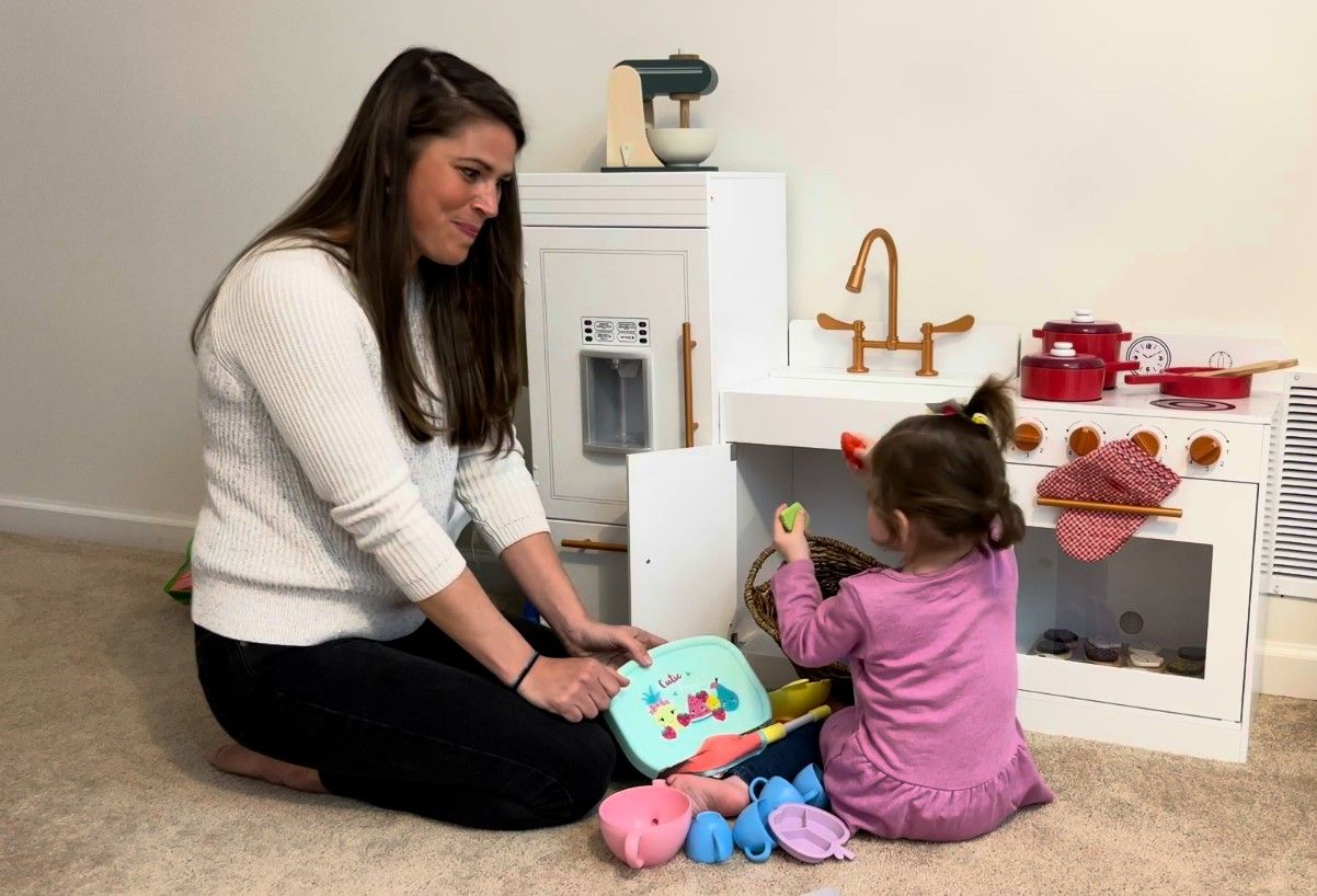 child care provider playing with child
