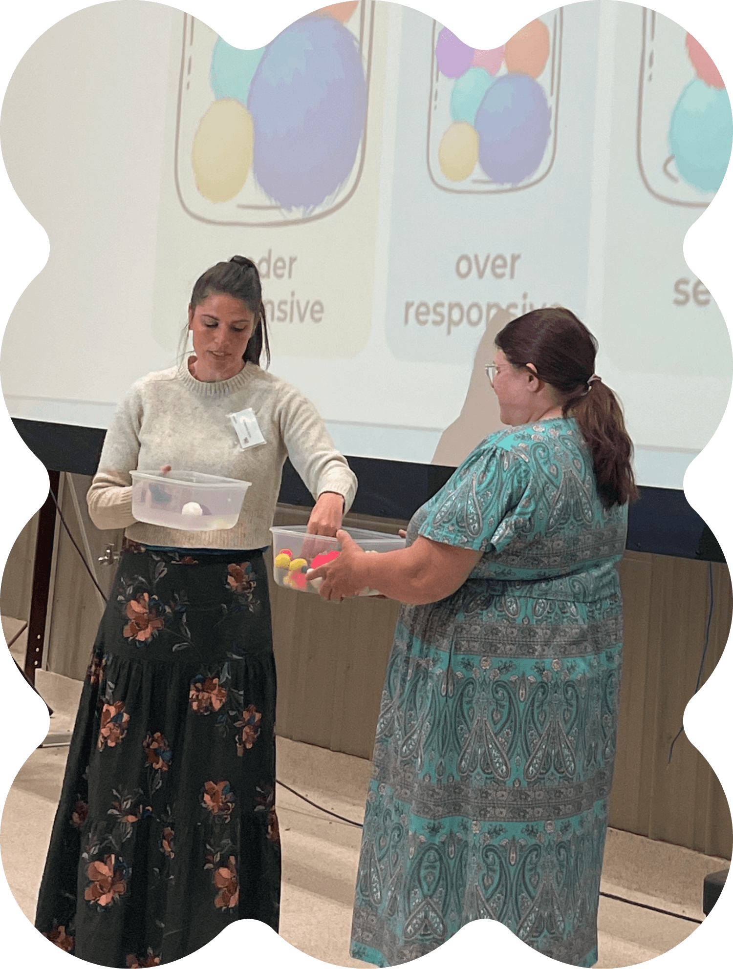 Kelly Goldberg giving in person training demonstrating a concept with a teachers help
