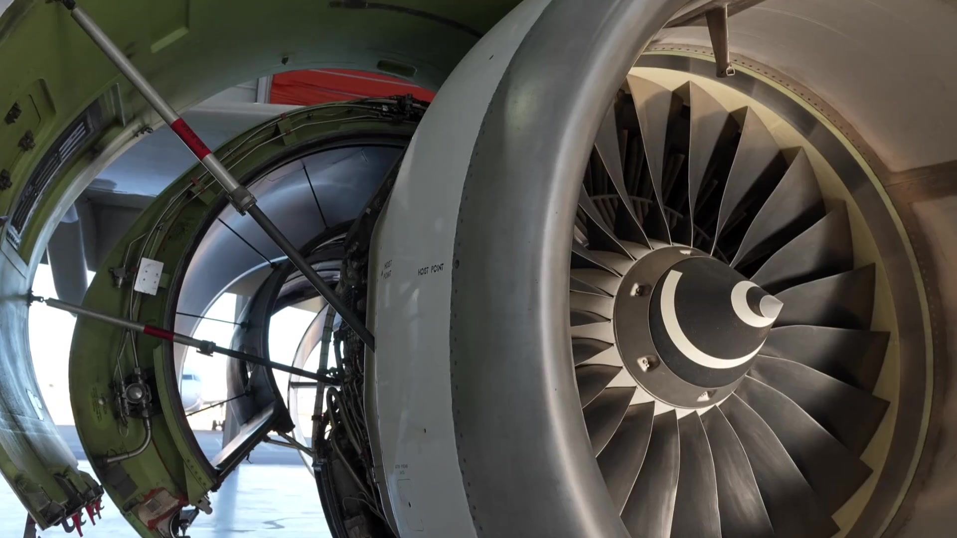 Open jet engine cowl showing turbine fan blades