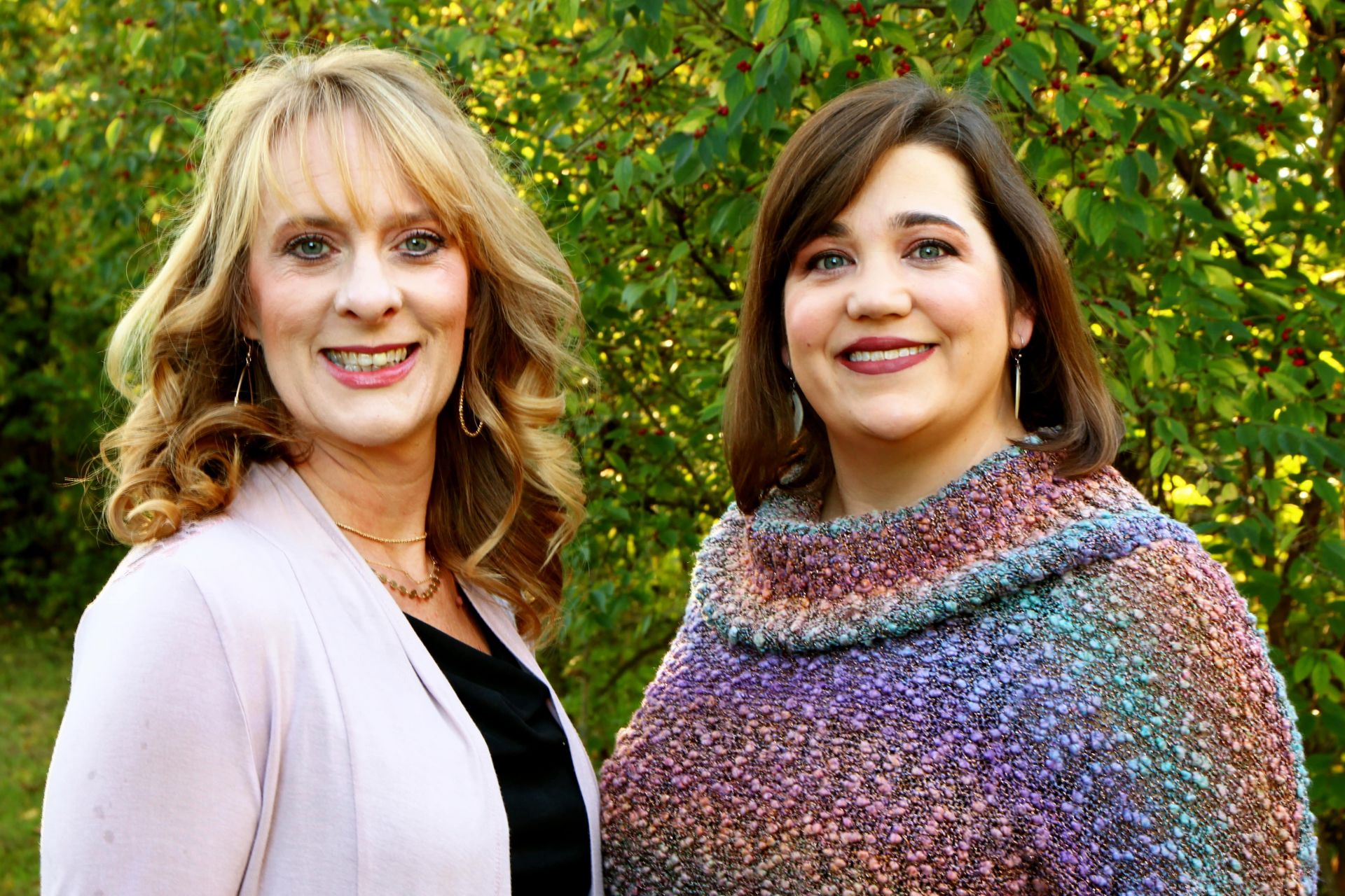 photo of Kim Breeden and Niccole Rowe with green trees in background