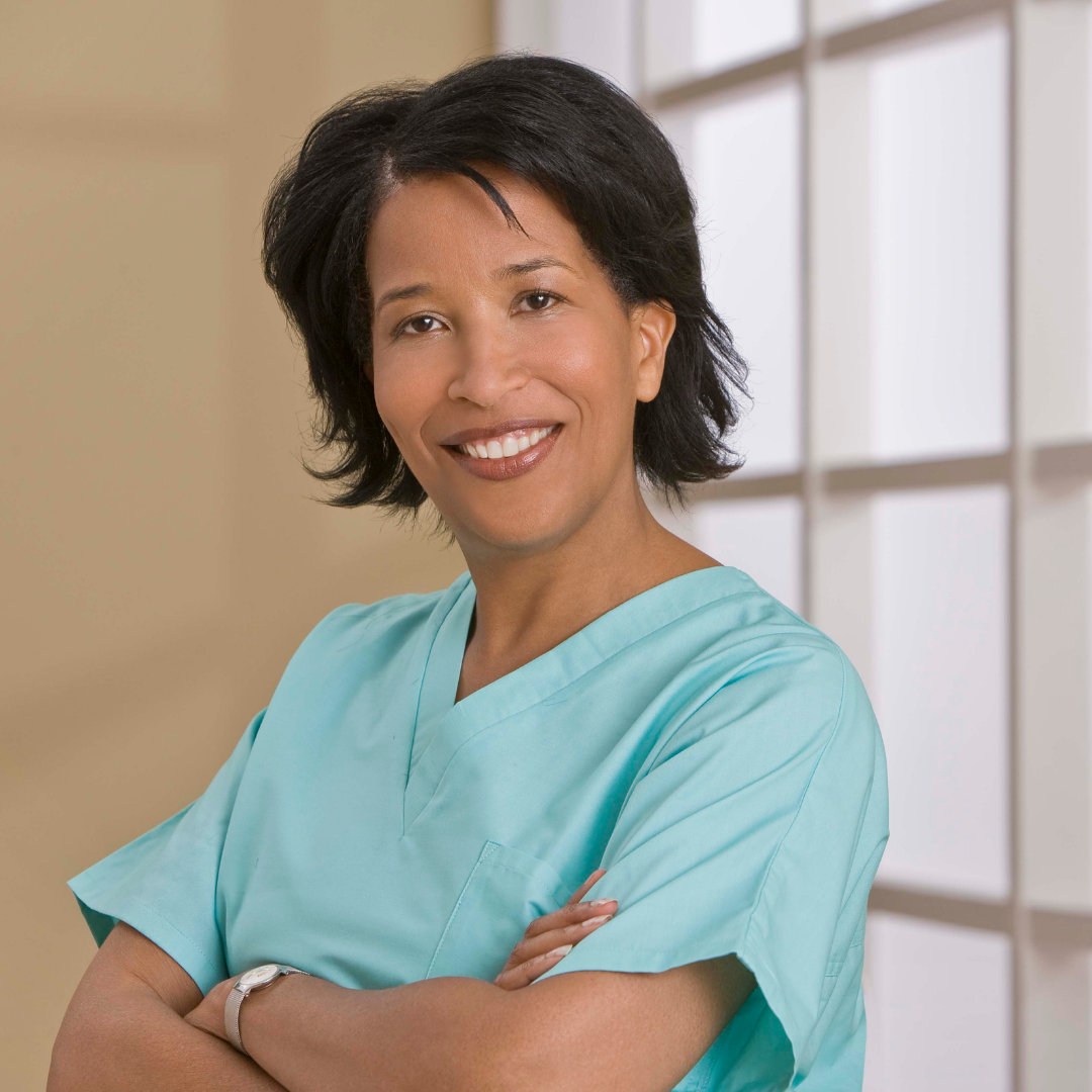 photo of black woman in scrubs with arms crossed