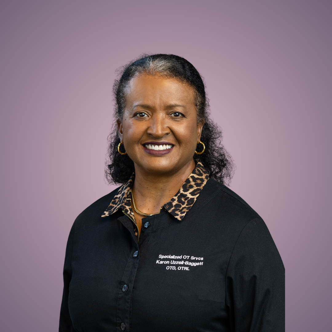 A smiling black woman in a natural background