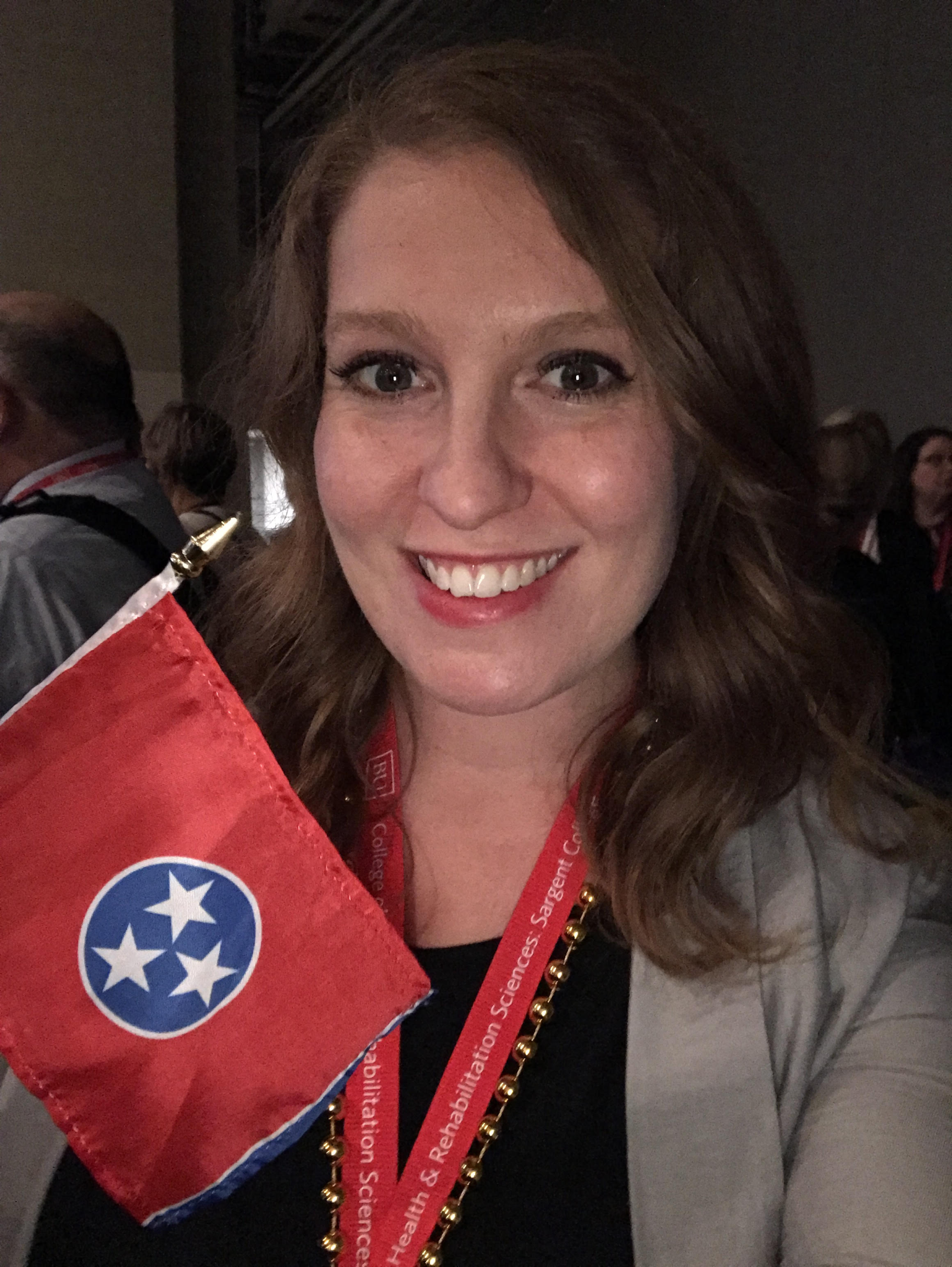 TNOTA President, Cindy DeRuiter Blackwell holding a Tennessee flag 